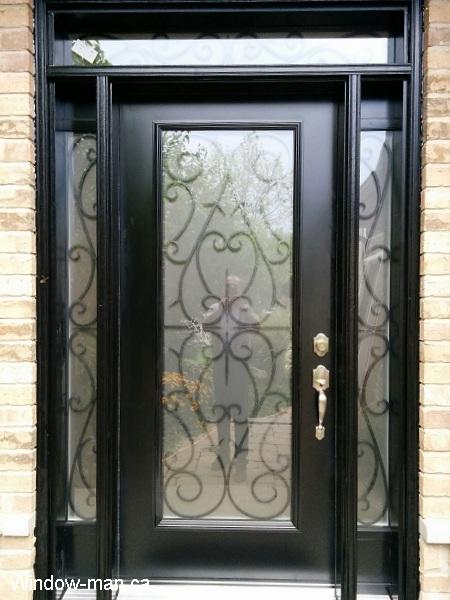 Single steel entry insulated front door and two sidelights and transom. Black. Bristol wrought iron glass inserts